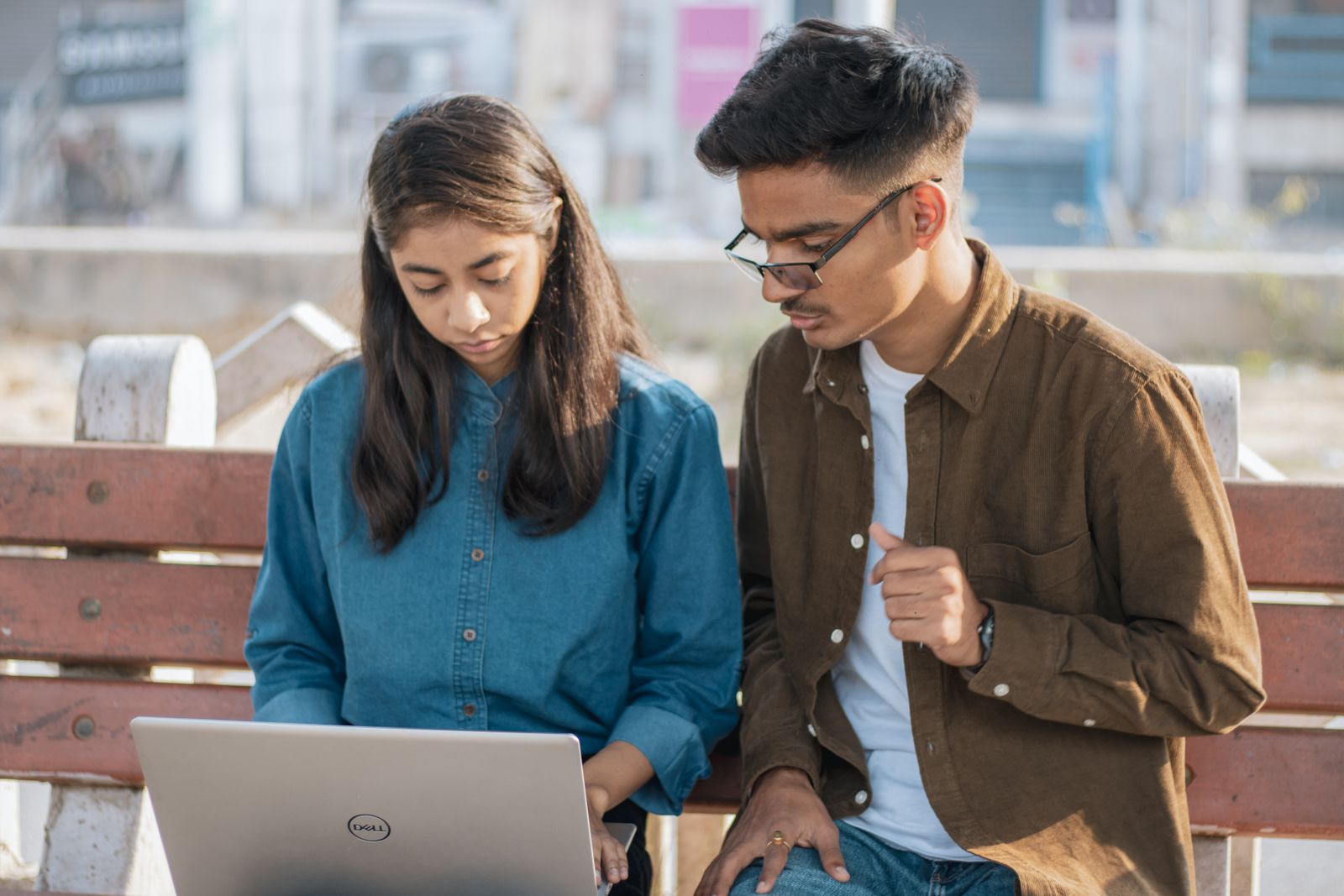 Students building a project together on a laptop